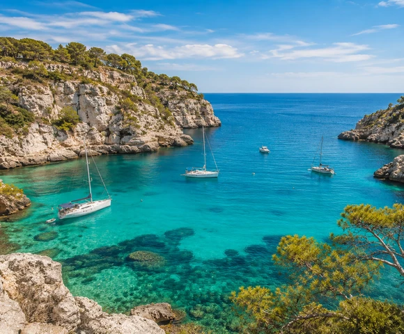 Turquoise cove with limestone cliffs in Spain's Balearic Islands